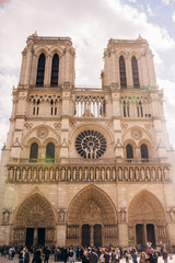 Fototapeta na wymiar the facade of Notre-Dame Cathedral, a medieval Cathedral Church in Paris, France.