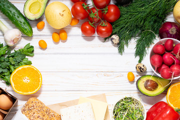 Assortment of healthy organic food on white wooden background with copy space for your design. Food delivery of farmer’s market banner.
