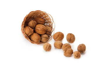 Whole walnuts in the basket .