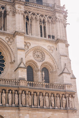 Fototapeta premium Architectural fragments of Reims Notre-Dame cathedral. Notre-Dame de Reims Cathedral Our Lady of Reims, 1275 is Roman Catholic Church in Reims. France.