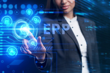 Business, Technology, Internet and network concept. Young businessman working on a virtual screen of the future and sees the inscription: ERP