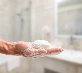 Man holding a bar of soap