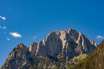 Jerebica or Cima del Lago. Mountain peak of the Julian Alps on the border between Slovenia and Italy, from Log pod Mangartom village, in Triglav National Park, Slovenia, Europe