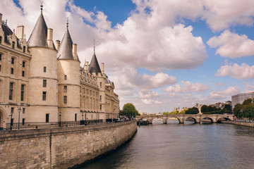 View of Conciergerie - former prison and part of old royal palace on Seine river bank in Paris, France.