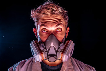 Evil and creepy science experiment concept, a scary scientist in gas mask respirator with yellow glowing demon eyes on a dark dusty enviroment wearing white doctor coat.