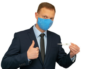 The man in a medical mask and with thermometer showing thumb up because temperature 36.6