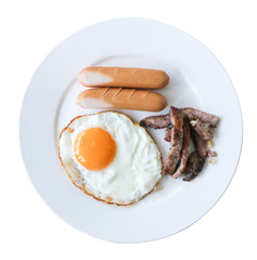 Breakfast sausages, fried eggs, fried pork in a white plate on a separate white background