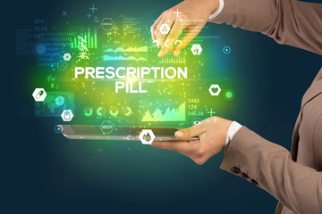 Close-up of a touchscreen with PRESCRIPTION PILL inscription, medical concept