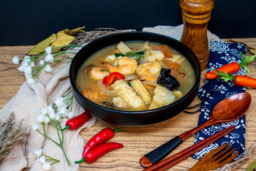 Bowls of Asian soup noodles and vegetables with Chopstick