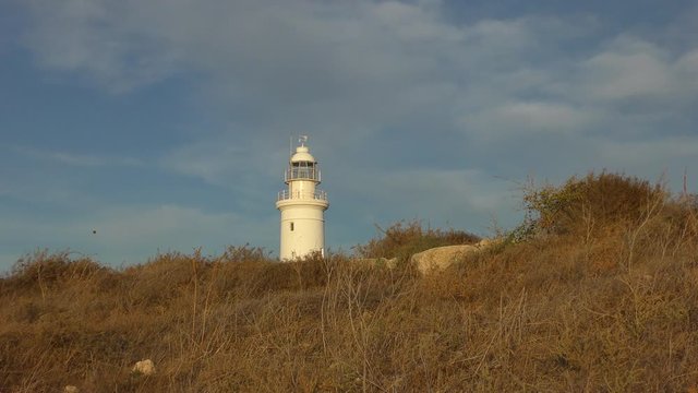 Old lighthouse against the evening sky.