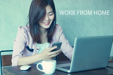 Beautiful smart  young woman working on laptop at home in living room.work from home.
