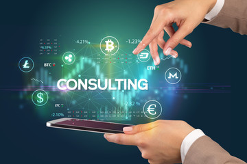 Close-up of a touchscreen with CONSULTING inscription, business opportunity concept