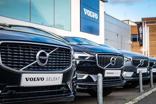 LONDON- JANUARY, 2020: Volvo car dealership, many cars parked outside showroom with Volvo logo above. Swedish vehicle manufacturer