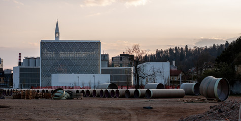construction site and modern white islamic mosque