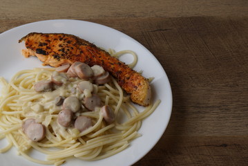 Spaghetti Carbonara with grilled salmon and herb by lemon