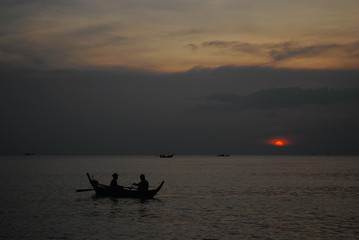 Fishing boat at sunset in Thailand, Asia.