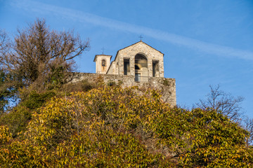 Fototapeta na wymiar Old church on the top of the hill in Castelveccana
