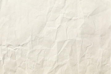 Old pale yellow crumpled paper background texture