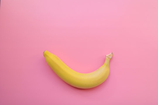 yellow bananas on a pink background