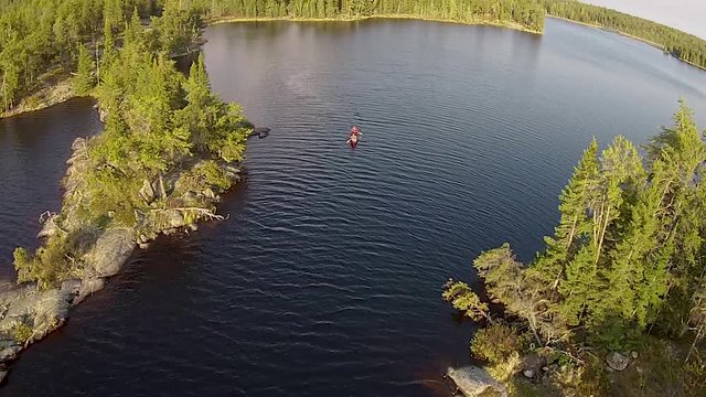 Paddling a lake in the rocky Canadian Shield country of eastern Manitoba.