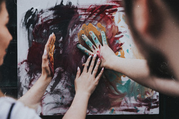 young woman painting her hands