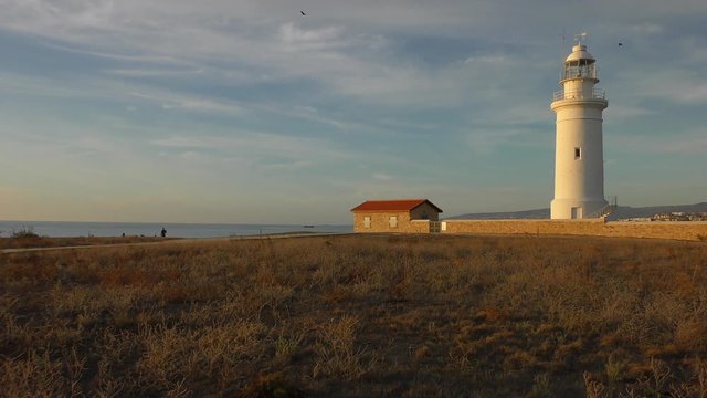 Lighthouse and caretaker house. Mediterranean coast, Kato harbor near Paphos.