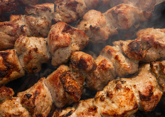 Nice, tasty, closeup grilled meat shashlik with a golden crust. 