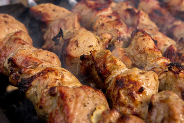 Nice, tasty, closeup grilled meat shashlik with a golden crust. 