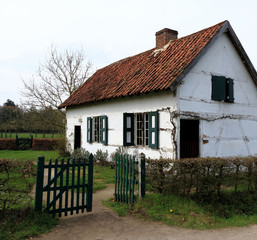 Fototapeta na wymiar white farmhouse with fence, Bokrijk, Belgium