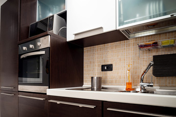 Fototapeta premium Modern comfortable kitchen, equipped with everything you need. Nice place to cook.