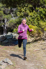 Young man running up the hill. Trial run.
