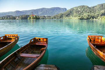 Lake Bled, wooden boats and pilgrimage church of the assumption of maria in Slovenia