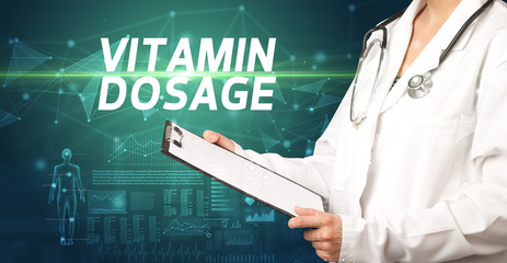 doctor writes notes on the clipboard with VITAMIN DOSAGE inscription, medical diagnosis concept
