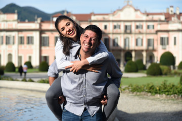 Happy Woman on Man's Shoulders