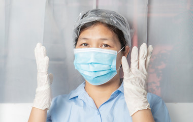 Naklejka premium Asian women wear medical masks, medical gloves, before leaving the house. , To prevent coronavirus, covid-19