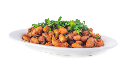 Lobio is a Georgian dish and parsley in a plate isolated on white