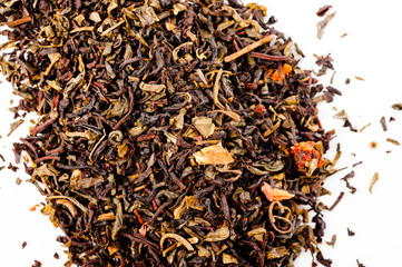 A mixture of black and green tea with vanilla-strawberry flavor, sliced strawberries and rose petals. Background for tea and antioxidants.