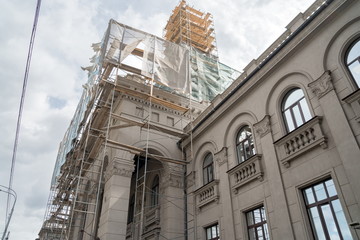 Fototapeta premium Scaffolding on the spire of the river station building (1952) during restoration. Krasnoyarsk Russia.