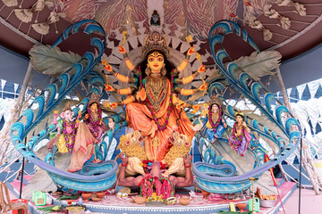 Idol of Goddess Devi Durga at a decorated puja pandal in Kolkata, West Bengal, India. Durga Puja is...