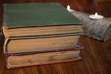 Close-up of old books on wooden table