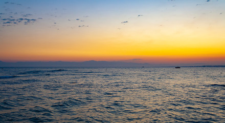 Sea, waves in the evening at sunset