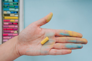 Crayon of art soft pastels in hand