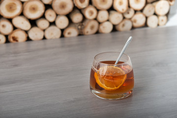 Tea with lemon on light wooden table