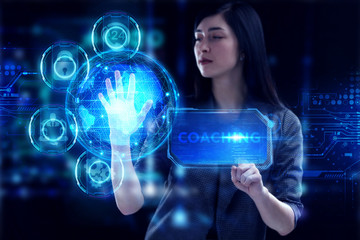 Business, Technology, Internet and network concept. Young businessman working on a virtual screen of the future and sees the inscription: Coaching