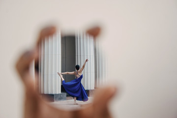
ballet dancer with ballet pose reflected in mirror