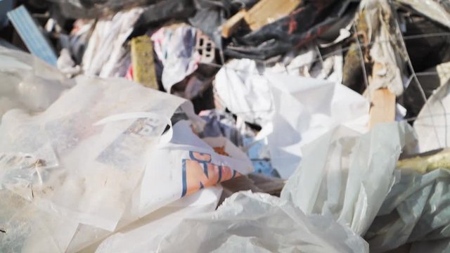 Big piles of garbage. Empty bottles, plastic in the waste dump. Pollution concept. Garbage heap in trash junkyard or landfill. Shooting on the Steadicam