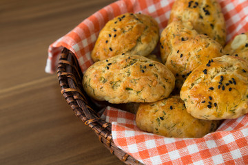 Turkish home made pastry product , tasty Pogaca on the wicker basket.