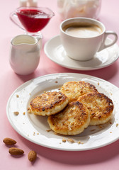 Curd cheese pancakes with jam. Traditional Breakfast with coffee. Healthy Breakfast, proper nutrition.