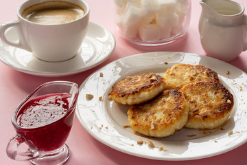 Curd cheese pancakes with jam. Traditional Breakfast with coffee. Healthy Breakfast, proper nutrition.