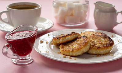 Curd cheese pancakes with jam. Traditional Breakfast with coffee. Healthy Breakfast, proper nutrition.